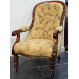 A Victorian mahogany framed Gentleman's Armchair, the spoon back with buttoned upholstery above seat