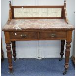 An early 20thC marble-topped Washstand, the walnut encasing the tiled gallery back, flanked by