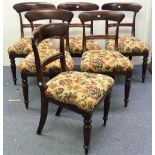 A set of six Victorian mahogany Dining Chairs, the curved top rail above another, on square