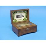 An early 20thC walnut Thorens three-air Music Box, the box, numbered '25', playing 'Home Sweet