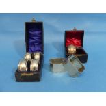 A cased set of four Edwardian circular silver Napkin Rings, by Constantine & Floyd Ltd.,