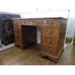 An Edwardian mahogany Pedestal Desk, with inset tooled green leather top, leather worn and scuffed.