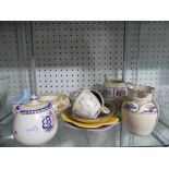 A small quantity of Poole Pottery; comprising a Poole Pottery Shell, Jug, two Tea Cups and