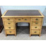 An Edwardian light oak Desk, with Rexine skived-in top, 48½in wide x 25½in deep x 40½in high (