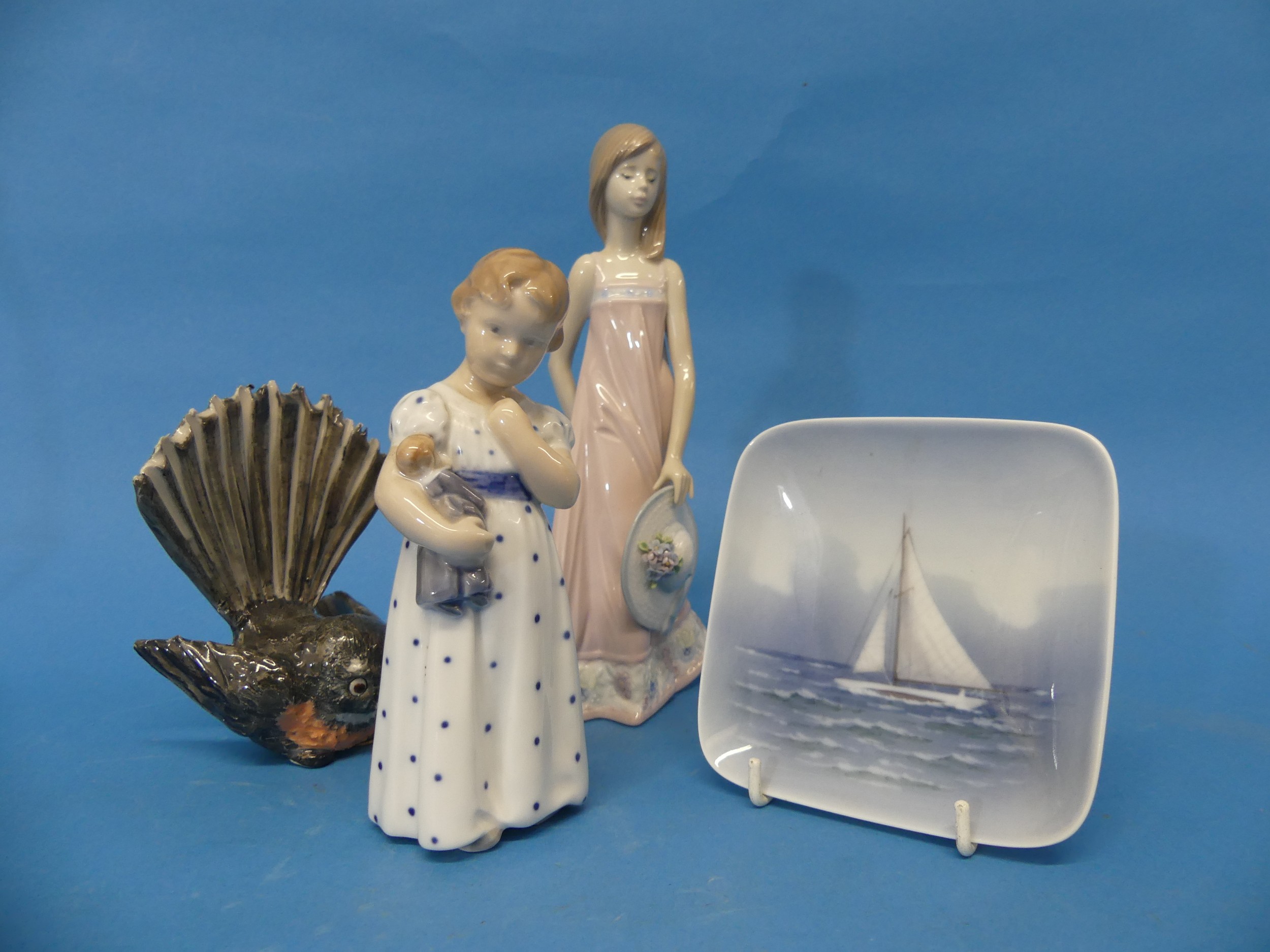 A Royal Copenhagen figure of a Child holding a Baby, with factory mark to base, together with a