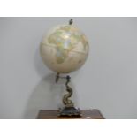 An antique style 'Classic' Globe, raised on an fish-shaped iron base, labelled CRAM Herff Jones