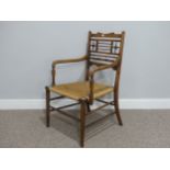An Aesthetic Movement William Morris style mahogany 'Sussex' Armchair, the open back with turned and