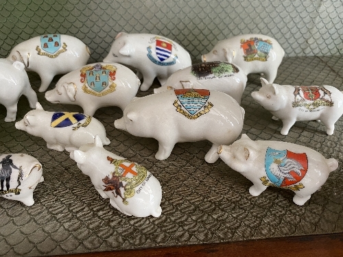 A large quantity of Crested China Pigs, all painted with different crests and place names, with - Image 7 of 8