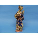 A 20thC Chinese ceramic Figure, of a lady carrying a child on her back, an impressed seal