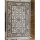 A Turkish hand-knotted wool Rug, brown floral pattern on a cream ground, 38in x 62in (96.5cm x 157.