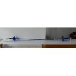 Two Victorian 'Bristol Blue' glass swords, with blue glass hilt and clear glass ribbed grip, the