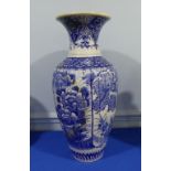 A late 19th century oriental blue and white porcelain Vase, painted with panels of exotic birds,