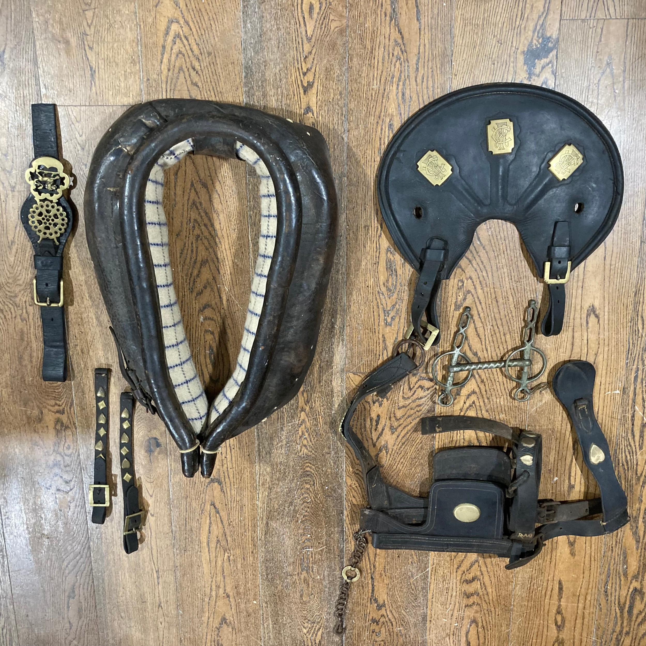 Equestrian interest; a selection of antique carthorse tack,