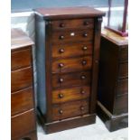 An early Victorian mahogany Wellington Chest, with seven drawers, carved brackets and turned