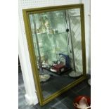 A large modern wall Mirror, framed with bevelled edge glass, 39in x 52in (99cm x 132cm)