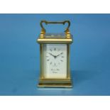 A brass four-glass Carriage Clock by Morrell & Hilton, Huntingdon.