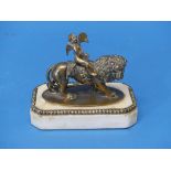 A 19th century continental gilt-brass 'Grand Tour' figure of cupid riding on the back of a lion,