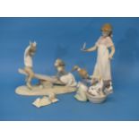 A Lladro 1255 Group on a Seesaw, together with a Lladro figure depicting a Dog Bath, a Nao figure of