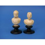 A pair of early 19th carved ivory busts of King William IV and Adelaide of Saxe-Meiningen, on