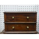 An early 20thC mahogany miniature / apprentice piece Chest of Drawers, the two long drawers with