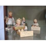 A small quantity of Hummel Figures; comprising 'Happy Pastime', 'Lets Sing', 'Little Hiker' and