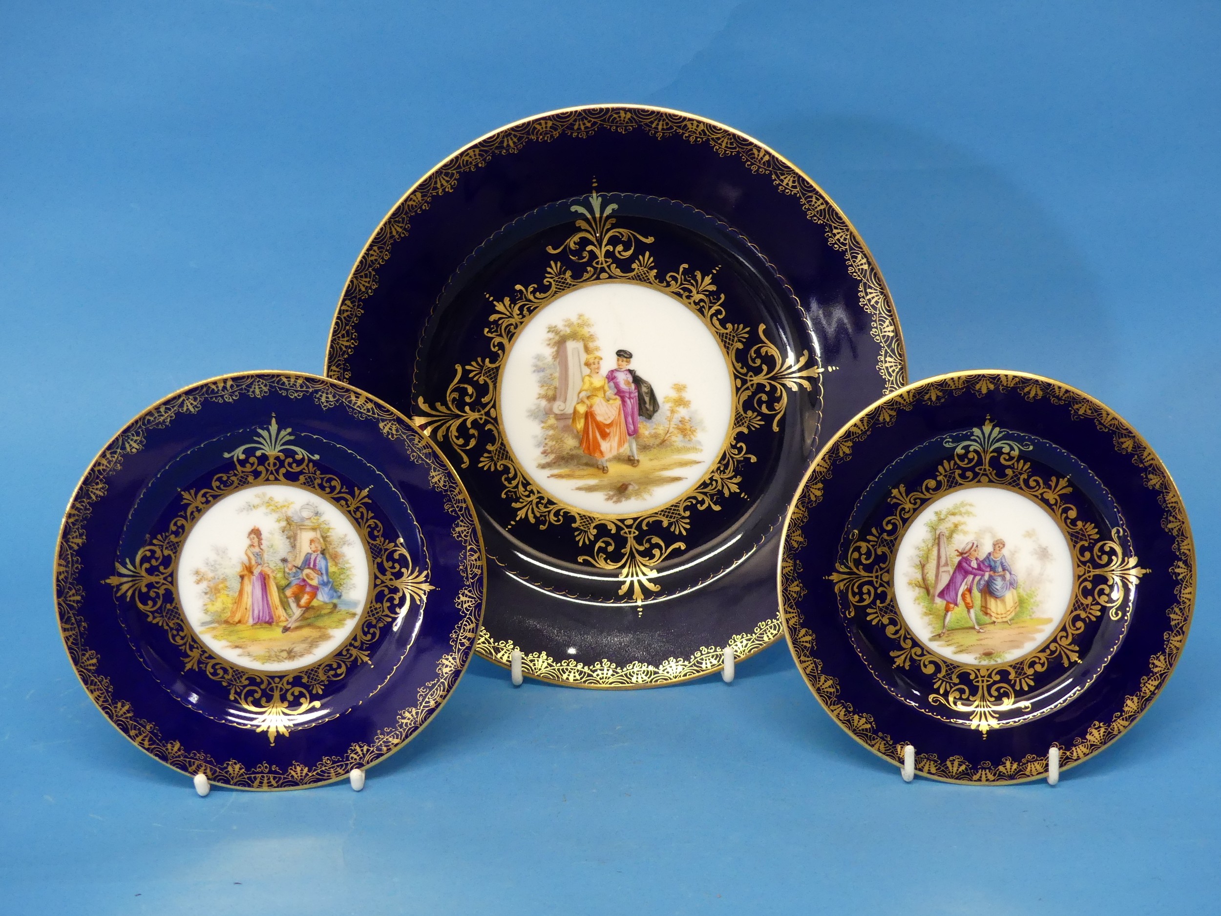 A large Vienna Porcelain Plate, together with two others, finely decorated with central classical