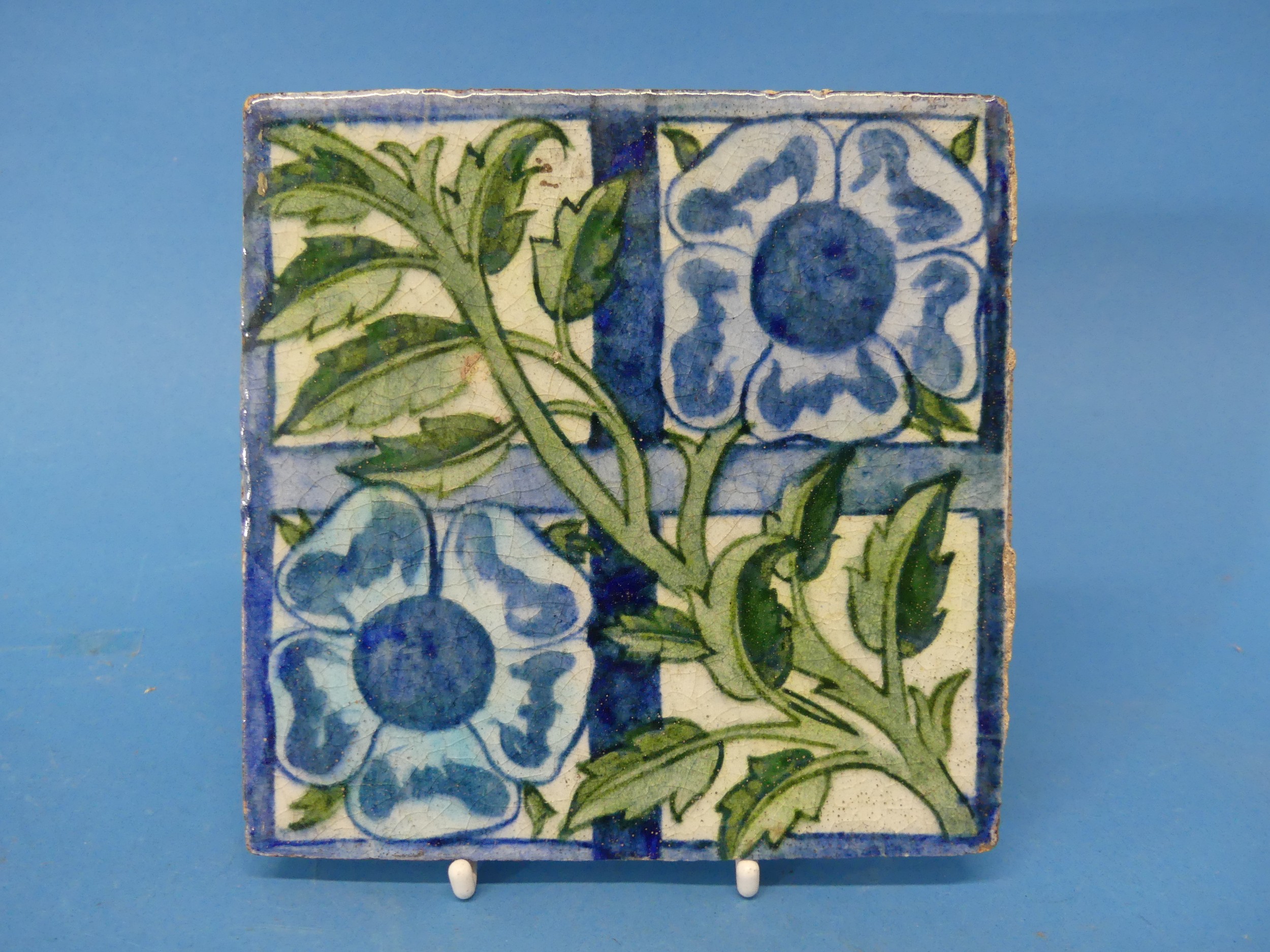 A William de Morgan 'Rose Trellis' pattern Tile, the tile decorated with rose and trellis, in greens