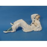 A Rosenthal porcelain Figure of Pierrot, designed by Rudolf Greiner, reclining in black and white