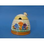 An early 20thC Clarice Cliff Newport Pottery 'Spring Crocus' pattern Honey Pot, with bee finial,