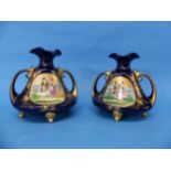A pair of early 20thC Continental porcelain Vases, the twin handled Vases, in blue ground, with