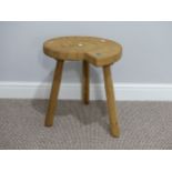 Contemporary design: a craftsman-made oak Ammonite three legged side table/stool, the top shaped and
