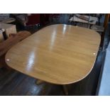 An Ercol light elm extending Dining Table, 66in (169cm) long when extended, 43in (110cm) wide,