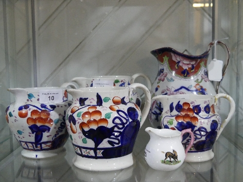 Set of four graduated Staffordshire Jugs, decorated in the imari palette, together with Large