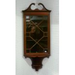 An Edwardian mahogany corner Cabinet, with swan-neck pediment and astragal glazing, 18in (45.5cm)