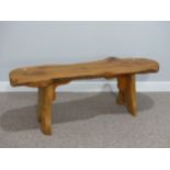 A craftsman-made wooden bench in Naturalistic style, 48in (122cm) long