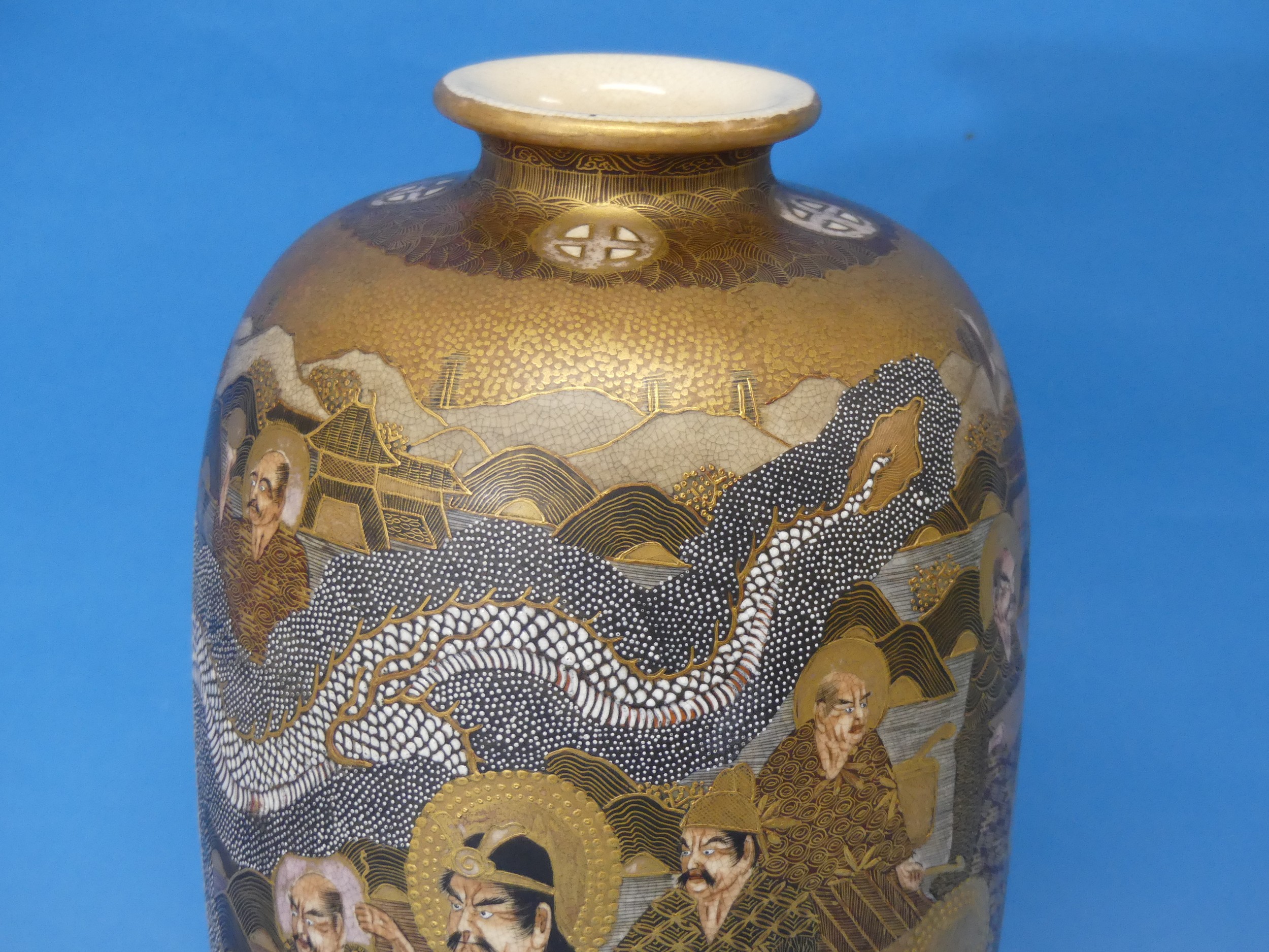 An early 20thC Japanese Satsuma Vase, depicting characters' faces, dragons and temples, with a - Image 3 of 8