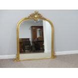 A large arched giltwood over-mantel Mirror, 57in (145cm) wide, 52in (132cm) high.