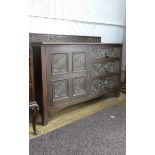 A Victorian carved oak Sideboard, with single cupboard and three drawers, the drawer fronts carved