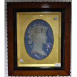 A Wedgwood Jasperware portrait Plaque, in blue ground, Bacchanal, in ovular mount, framed and