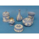 A small quantity of Wedgwood Jasperware, blue in colour, comprising lighter, lidded pot, vases