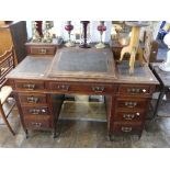 A late 19thC mahogany 'Dickens' Pedestal Desk, with leatherette top and gilt brass gallery rail,
