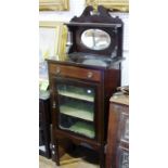 An Edwardian walnut mirror-back sheet music Cabinet, with inlaid decoration, the raised back above a