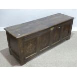A 17th century and later oak Coffer, the associated hinged top with moulded edge above a carved