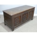 A 17th century and later oak Coffer, the associated lid with moulded edge, above a carved frieze and