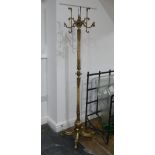 A brass and onyx Hall Stand, 68in (173cm) high.