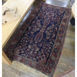 Tribal rugs; a dark blue ground Persian hand-knotted rug,