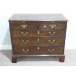 A Georgian mahogany chest of drawers with slide, the rectangular top above brushing slide, two short