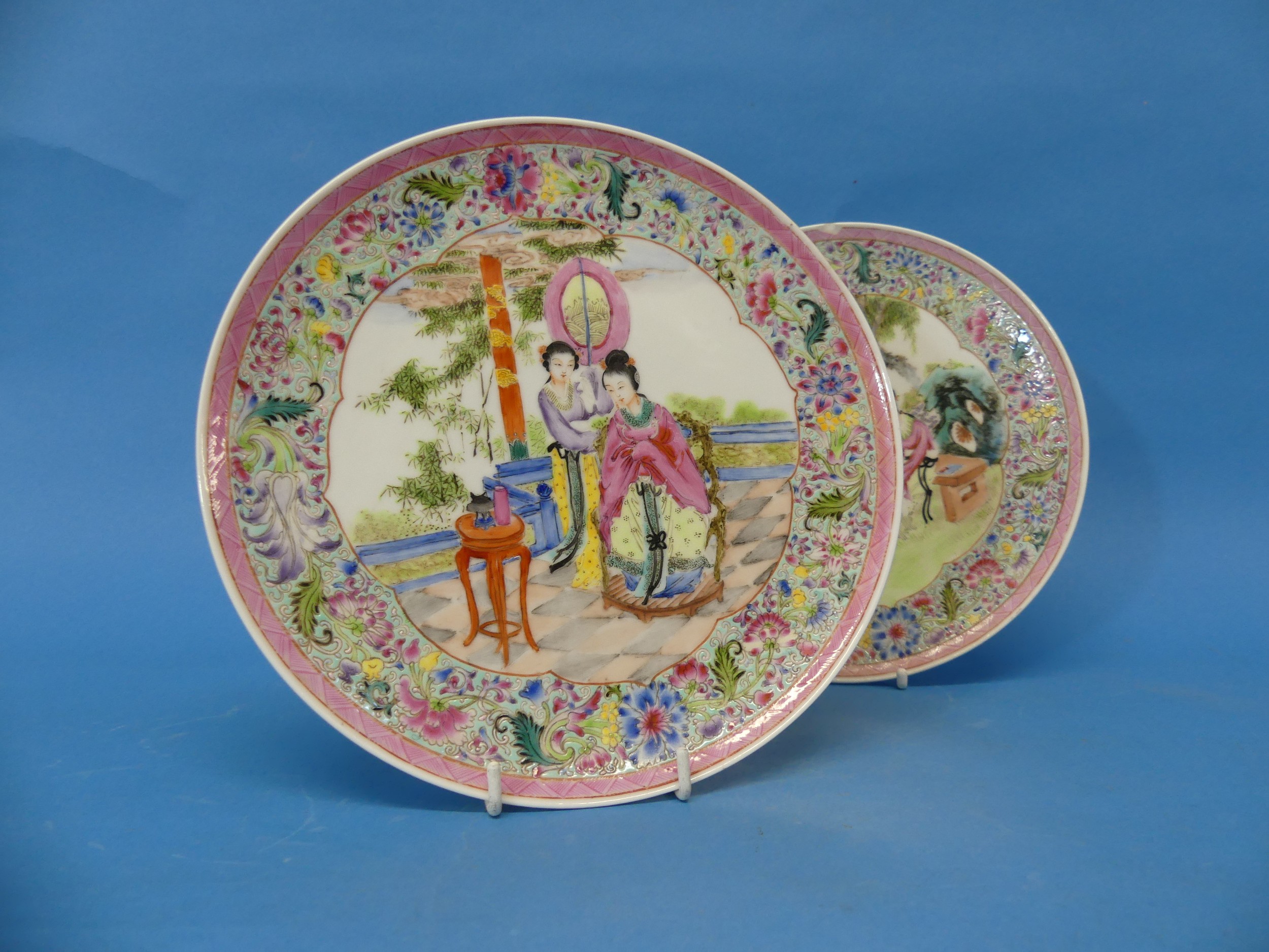 A pair of early 20thC Chinese porcelain Wall Plates, one chipped, red character mark to base,