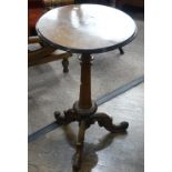 An early 20thC continental walnut Wine Table, with circular top and carved tripod base, 17½in (44cm)