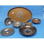 A quantity of Arts and Crafts metalwares; comprising a Hugh Wallis hammered copper bowl with